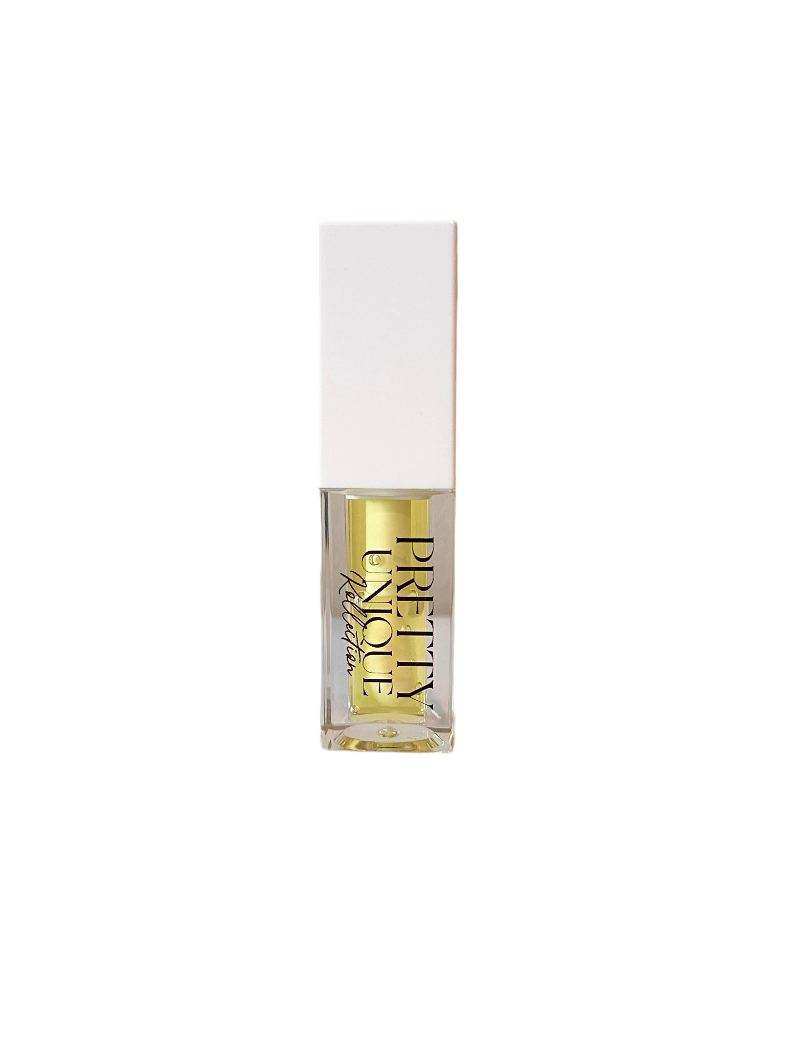 Lip Oil Lemon Drop in clear bottle with yellow liquid and droplet